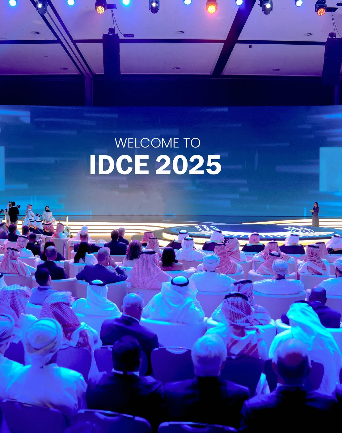 Opening plenary under the Welcome to IDCE 2025 screen