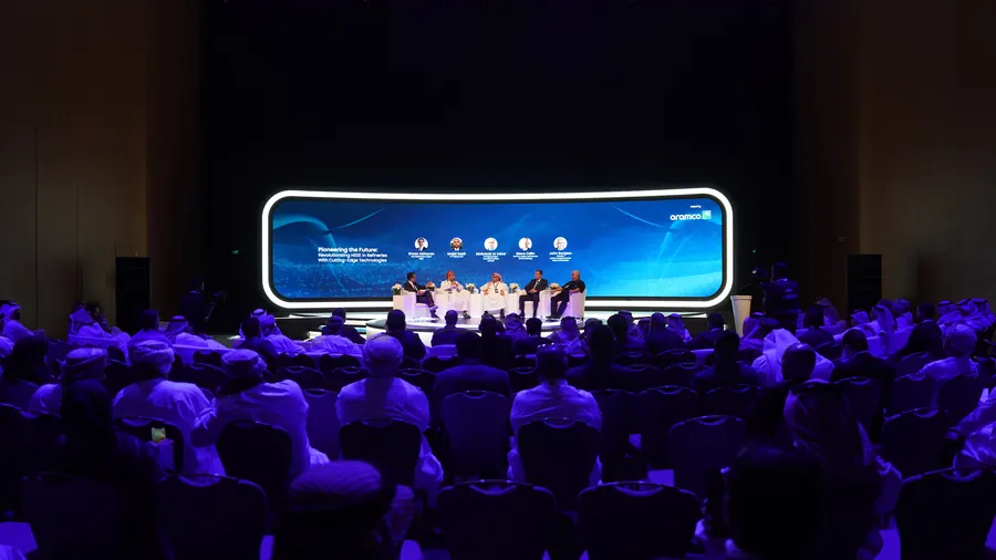 Panel discussion on the main stage in front of a full conference audience